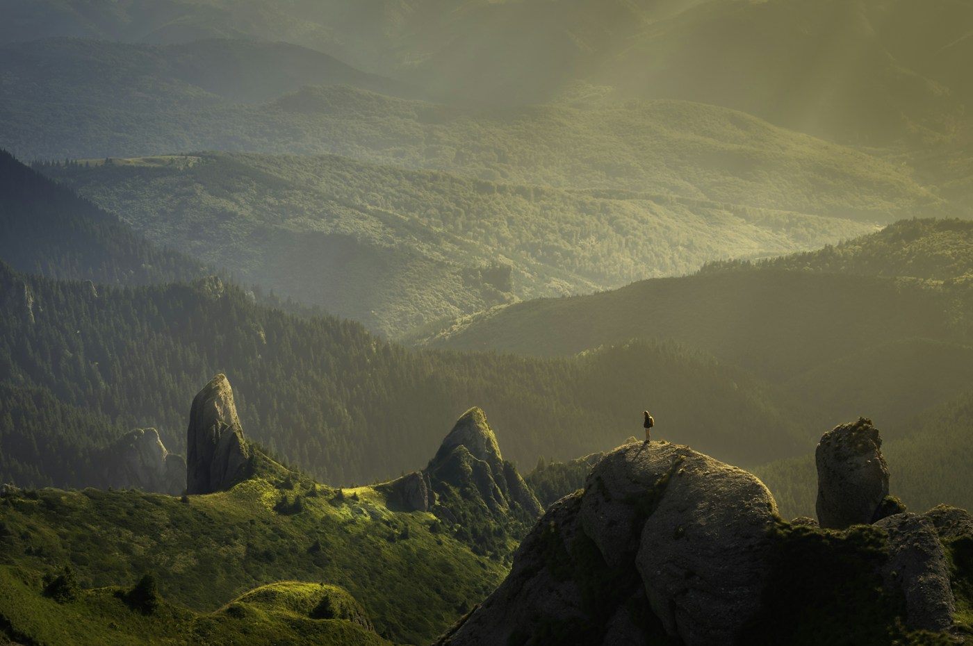Sunlit mountains overlooking a wide valley